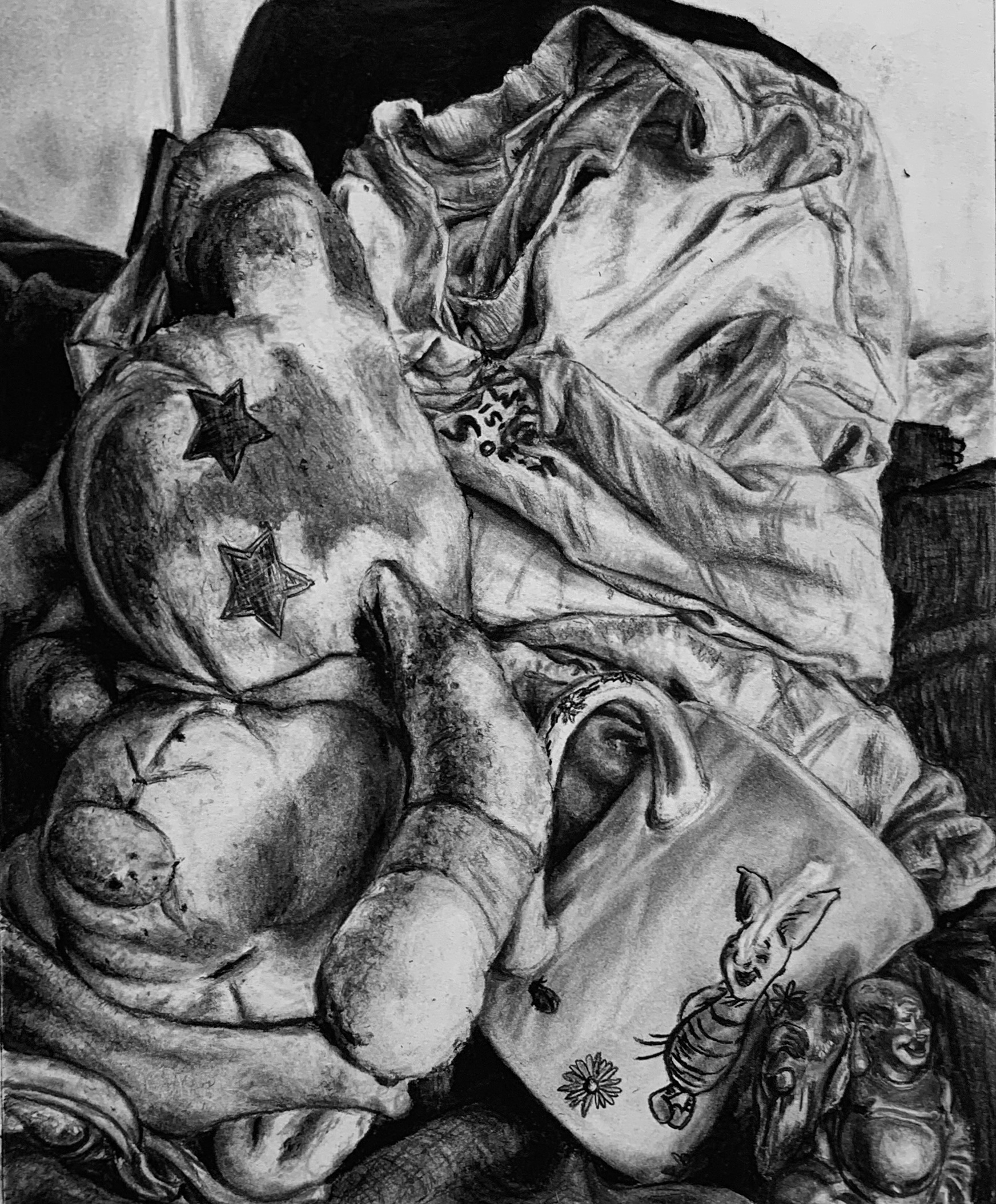 charcoal drawing of teddy bear, shirt, cup, buddah statue